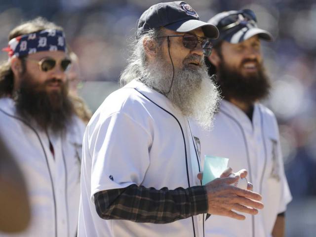 Willie, Si and Jase Robertson of &quot;Duck Dynasty&quot; are seen before throwing out the ceremonial first pitch in a baseball game, Sept. 22, 2013. (AP Photo/Carlos Osorio)