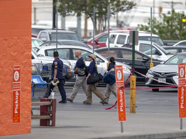 FBI agents arrive to the Walmart store in the aftermath of a mass shooting in El Paso, Texas, Sunday, Aug. 4, 2019 (AP Photo/Andres Leighton)