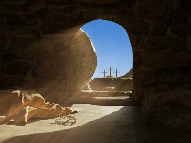 empty tomb with crown of thorns and robe on the ground
