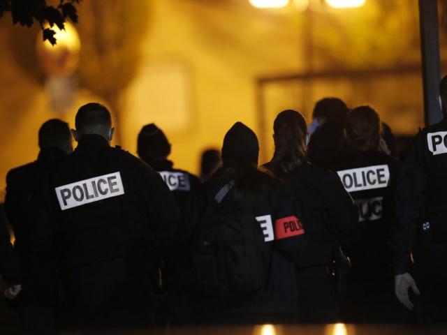 French police officers gather after history teacher was beheaded in Conflans-Saint-Honorine, north of Paris (AP Photo/Michel Euler)