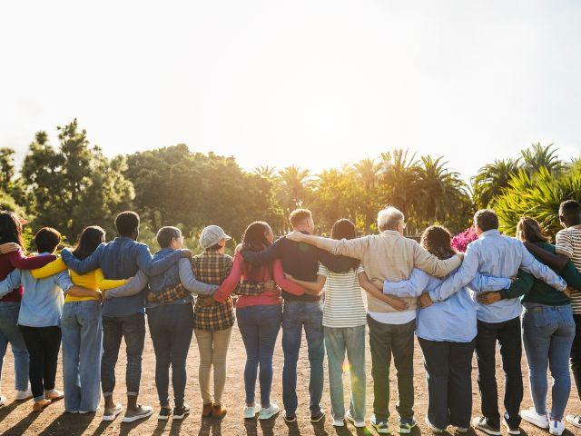 group of people with locked arms