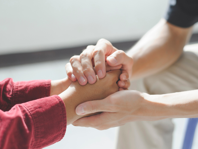 Caring hands holding