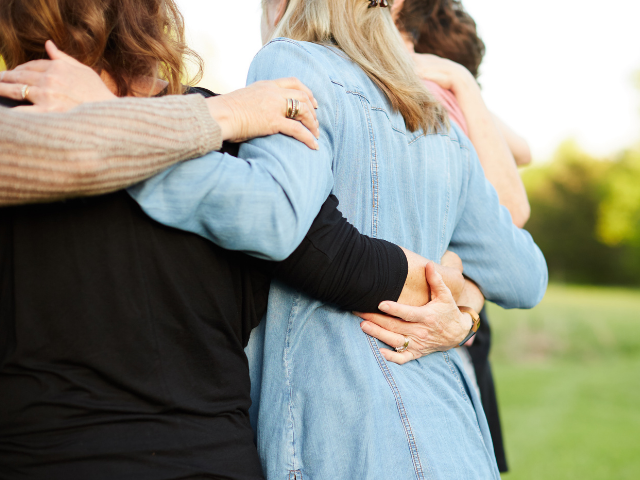 group of people holding hands