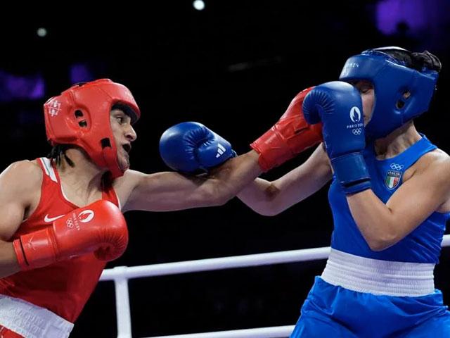 Algeria&#039;s Imane Khelif, left, fights Italy&#039;s Angela Carini in their women&#039;s 66kg preliminary boxing match at the 2024 Olympics, Aug. 1, 2024, in Paris. (AP Photo/John Locher)