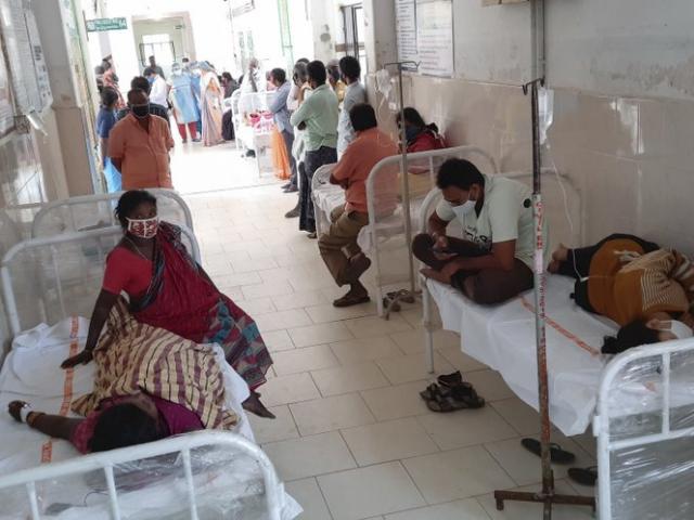 Patients and bystanders are seen at the hospital in Eluru, Andhra Pradesh state, India, Sunday, Dec.6, 2020. (AP Photo)