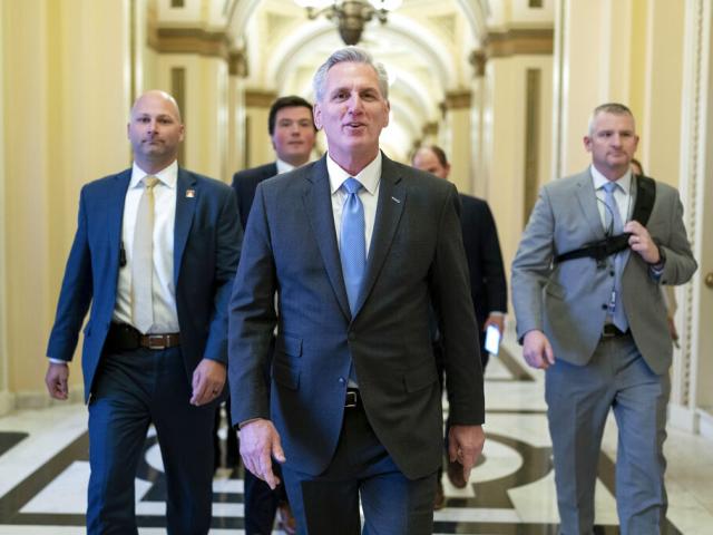 Speaker of the House Kevin McCarthy, R-Calif., talks to reporters as he walks to the speaker&#039;s ceremonial office at the Capitol in Washington, Jan. 9, 2023. (AP Photo/Jose Luis Magana)