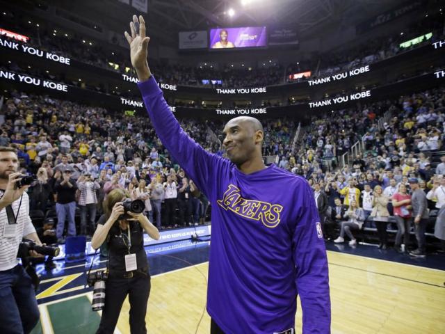 In this March 28, 2016, file photo, Kobe Bryant waves to the fans after his introduction before the start of the first quarter of an NBA basketball game against the Utah Jazz, in Salt Lake City. (AP Photo/Rick Bowmer, File)