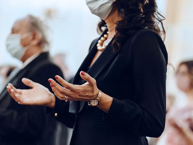 lady worships with mask