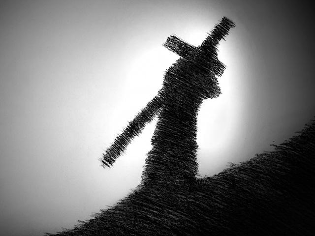 man-carrying-cross