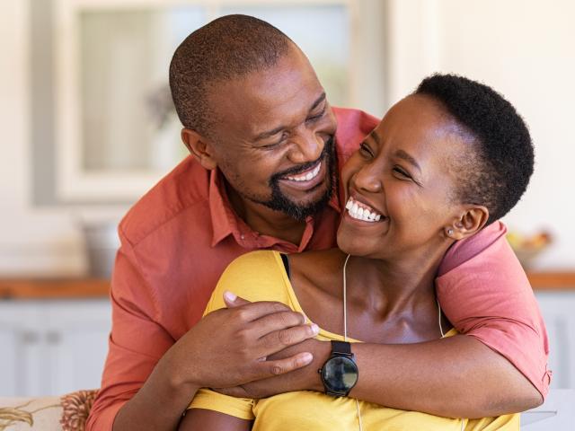 Mature couple hugging and smiling