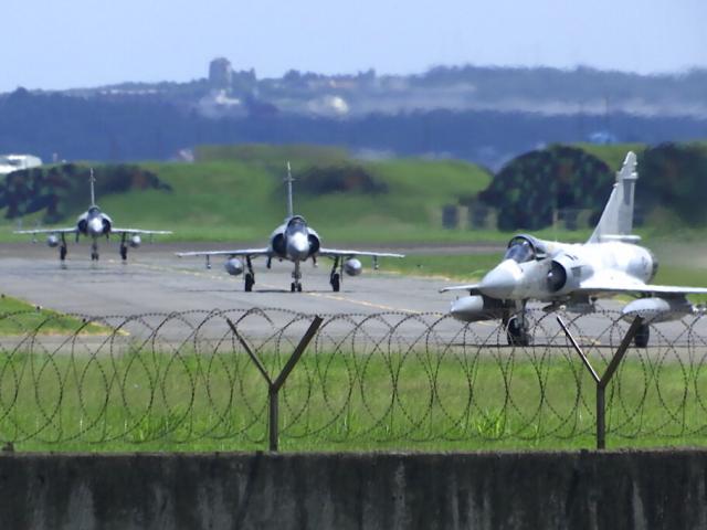 Taiwan Air Force Mirage fighter jets taxi on a runway at an airbase in Hsinchu, Taiwan, Friday, Aug. 5, 2022. (AP Photo/Johnson Lai)