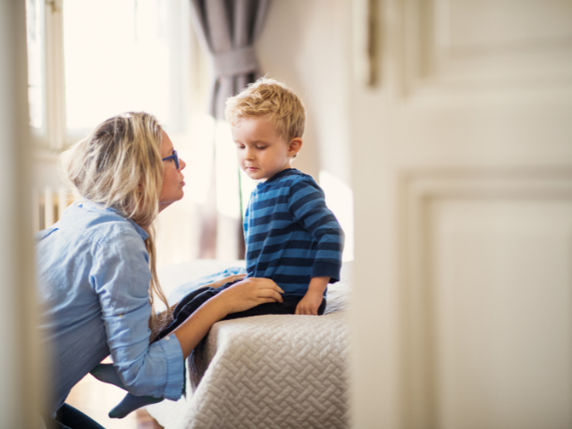 mother having a serious talk with her young son