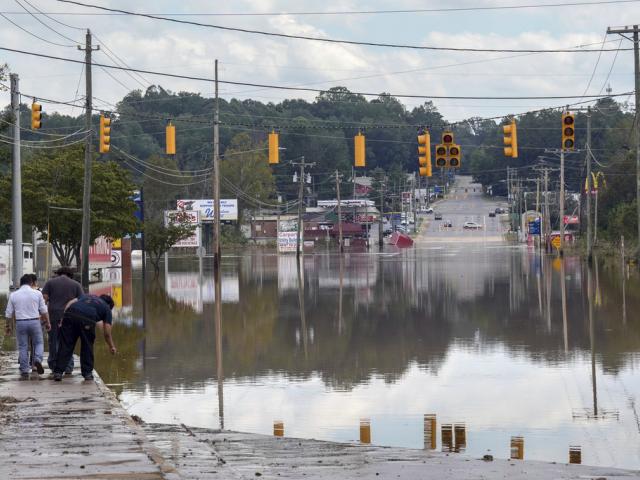 Flooding in Morganton, N.C. after torrential rain from Hurricane Helene left many area streets flooded, while also wiping out power lines and trees. (AP Photo/Kathy Kmonicek)