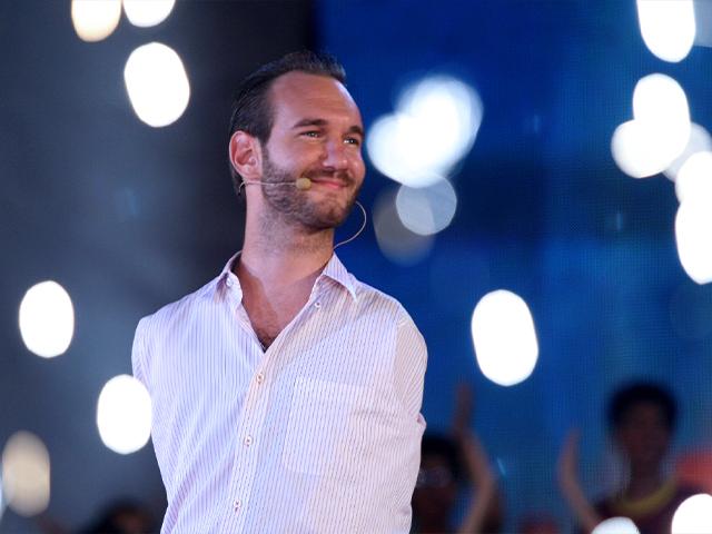 Nick Vujicic, a Christian evangelist who was born with no limbs, greets a crowd of 25,000 young people at My Dinh national stadium in Hanoi, Vietnam. (AP Photo/Na Son Nguyen)