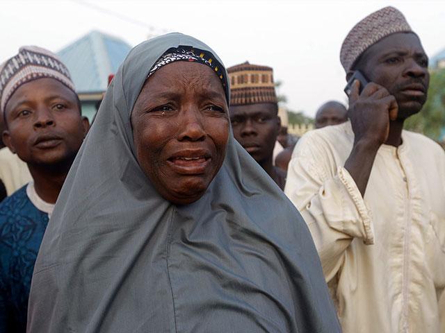 Nigerian families weep after their children were kidnapped from school (AP Photo/Sunday Alamba)