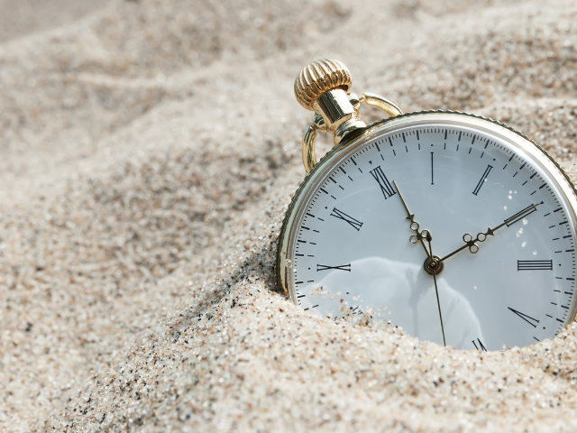 pocket watch in the sand