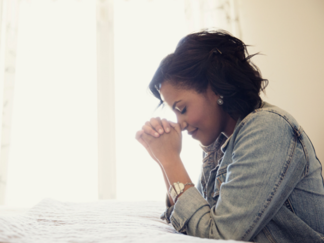 woman praying alone
