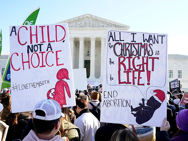 Supreme court hears arguments in a case from Mississippi, where a 2018 law would ban abortions after 15 weeks of pregnancy (AP Photo/Jacquelyn Martin)