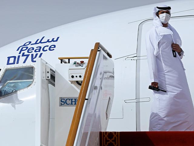 In this Monday, Aug. 31, 2020 file photo, an official stands at the door of an Israeli El Al airliner after it landed in Abu Dhabi, United Arab Emirates.(Nir Elias/Pool Photo via AP, File)