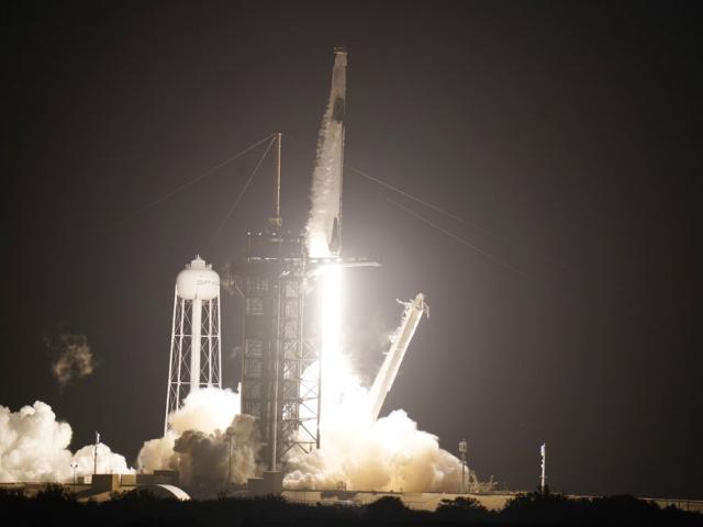 A SpaceX Falcon9 rocket, with the Crew Dragon capsule attached, lift&#039;s off from Kennedy Space Center (AP Photo/John Raoux)