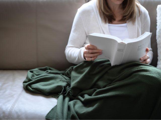 reading bible with blanket