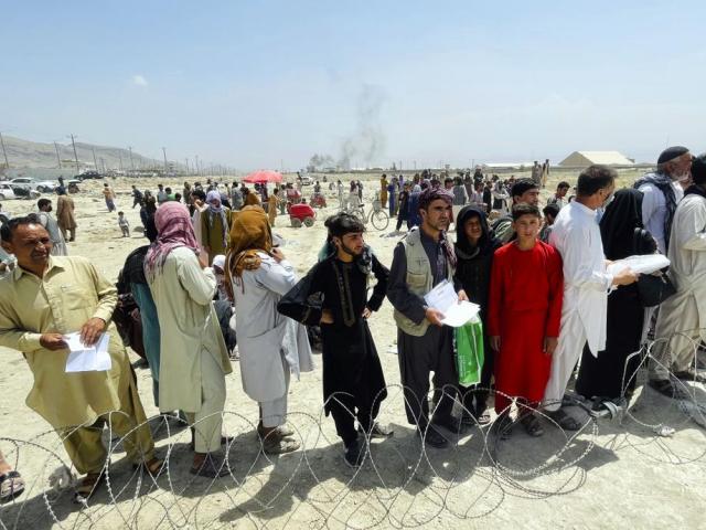 Hundreds of people gather outside the international airport in Kabul, Afghanistan, Tuesday, Aug. 17, 2021. (AP Photo)
