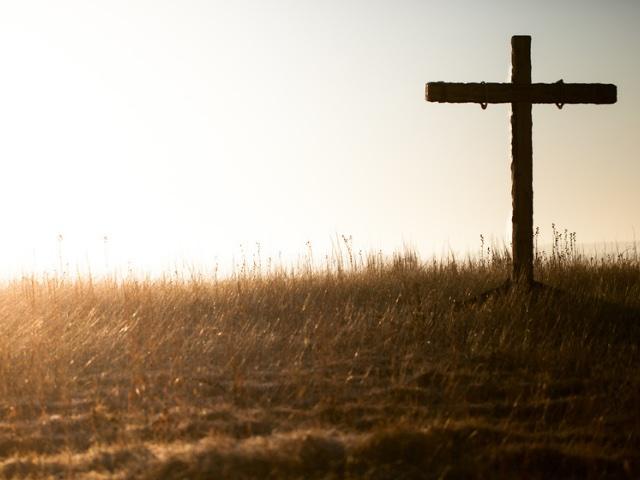 wooden cross on a hill