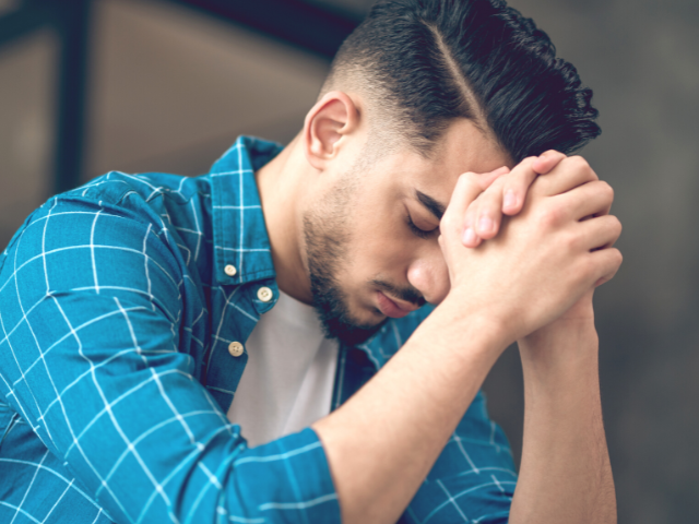 troubled young man praying