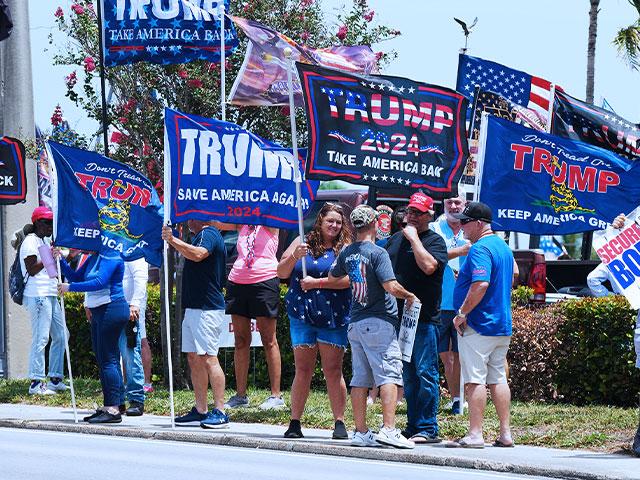 Supporters of former President Donald Trump gather along Southern Boulevard in West Palm Beach, Fla., Sunday, June 2, 2024. (AP Photo/Jim Rassol)