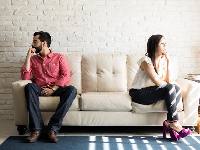 Unhappy couple facing away from each other