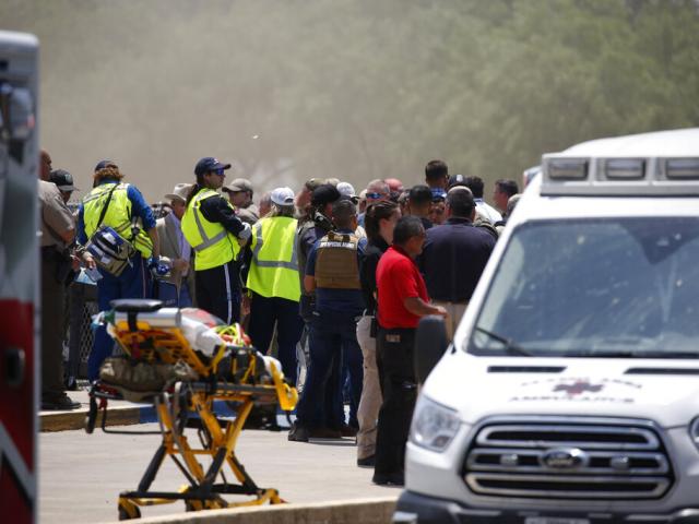 Emergency personnel gather near Robb Elementary School following a shooting, Tuesday, May 24, 2022, in Uvalde, Texas. (AP Photo/Dario Lopez-Mills)