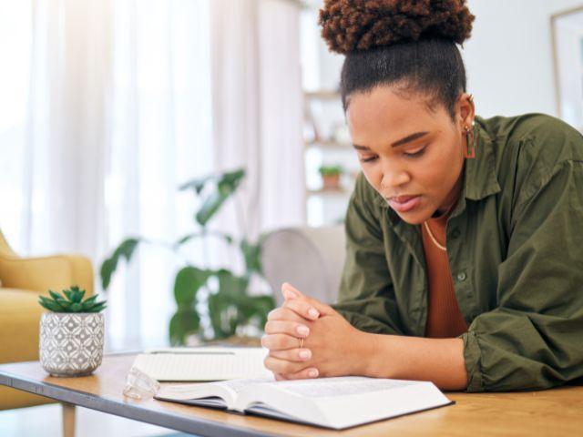 praying and reading bible