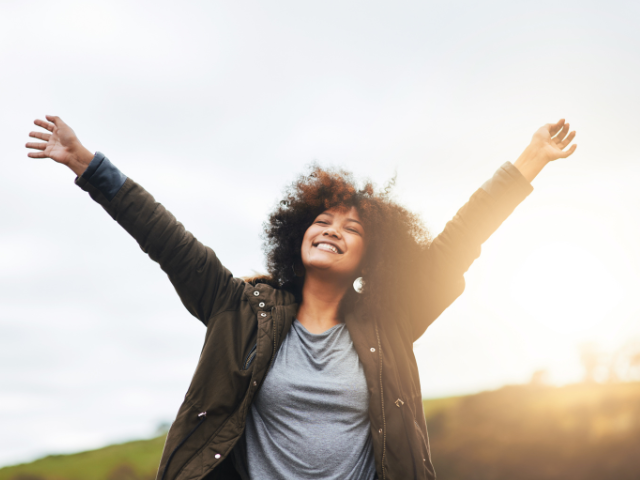 woman with her arms lifted