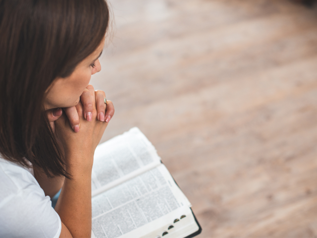 woman bible praying