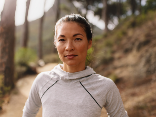 woman hiking on a mountain path