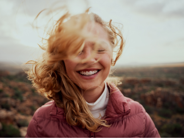 woman smile wind