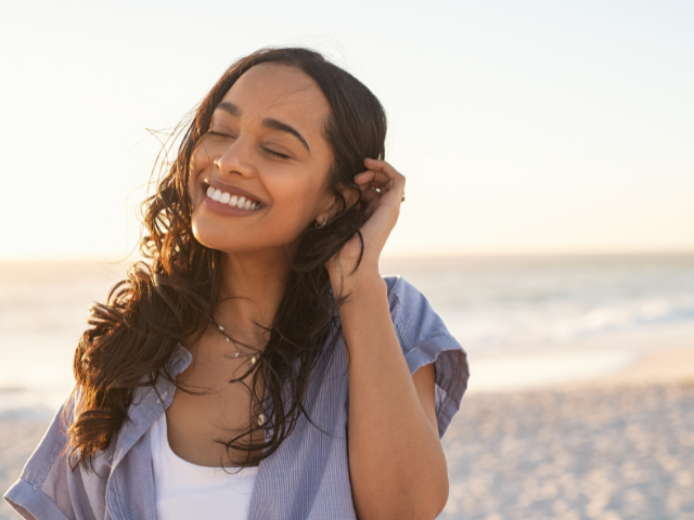 smiling woman at the seashore