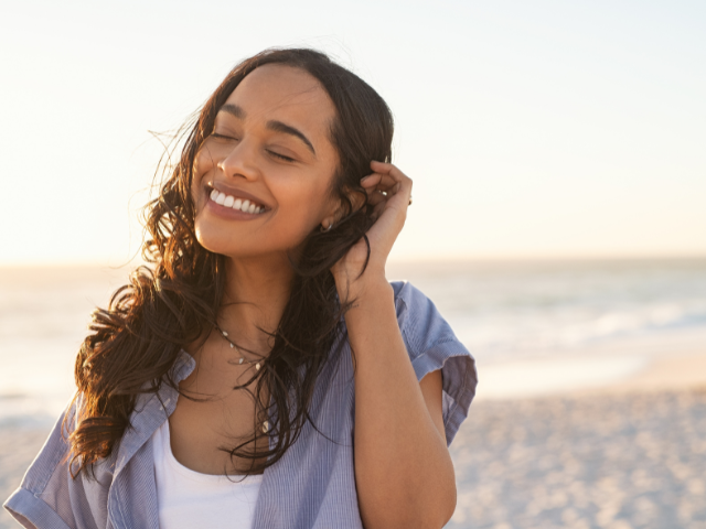 smiling woman at the seashore 