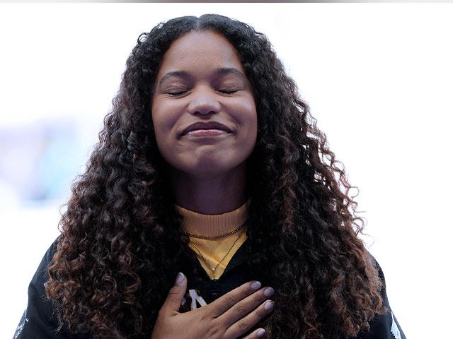 Women&#039;s shot put gold medalist Yemisi Ogunleye, of Germany, reacts on the podium at the 2024 Summer Olympics, Saturday, Aug. 10, 2024, in Paris. (AP Photo/Bernat Armangue)