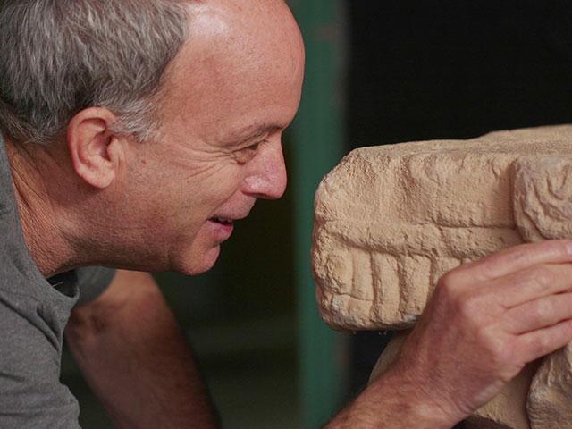 Dr. Uzi Ad, Excavation Director, with the rare stone capital. Photo Credit: Emil Aladjem, Israel Antiquities Authority.
