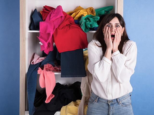 woman shocked at messy bedroom
