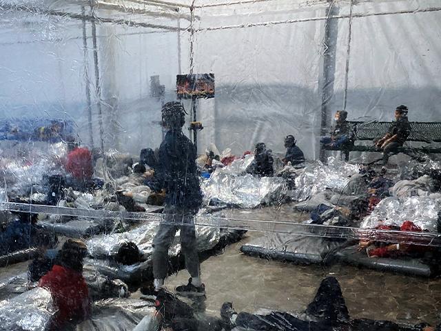 Detainees in a Customs and Border Protection (CBP) temporary overflow facility in Donna, Texas. (Photo courtesy of the Office of Rep. Henry Cuellar via AP)