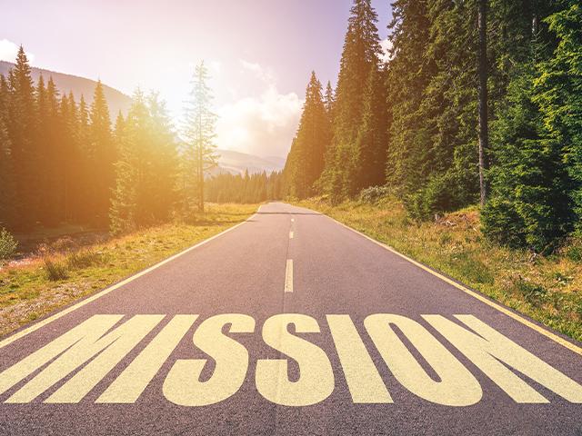 the word mission written across an open road ahead