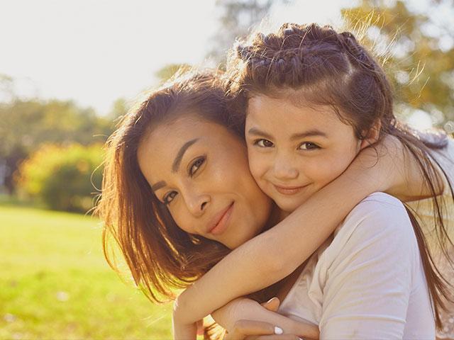 Mom and daughter hugging