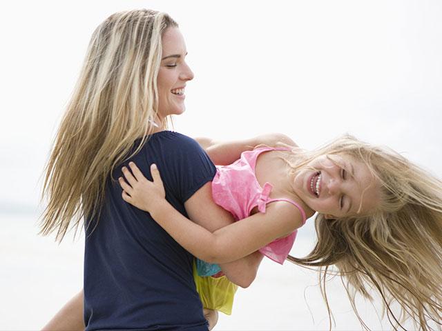 Mother and daughter spinning