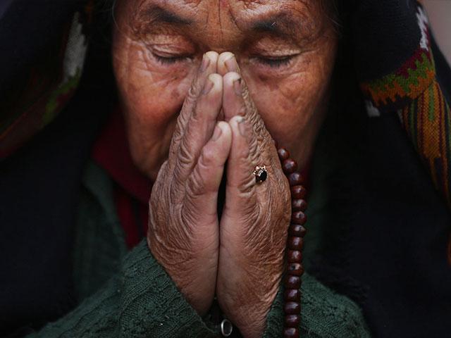 Nepal Woman Praying 