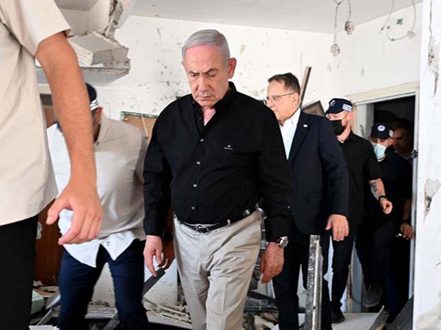Prime Minister Benjamin Netanyahu visits the area of the missile strike in Bat Yam, Israel, on Sunday, June 15, 2025. Photo Credit: Avi Ohayon.