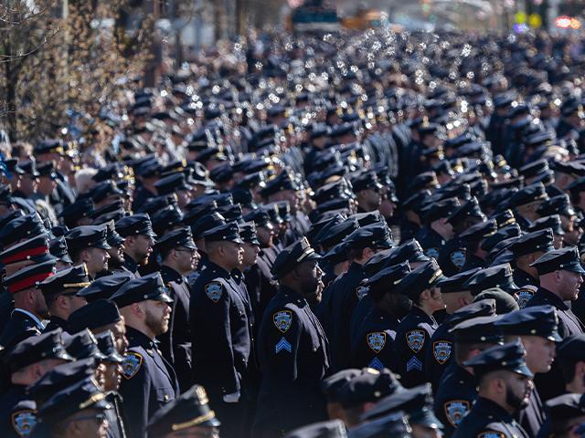 Police officers gather during a funeral service for NYPD officer Jonathan Diller at Saint Rose of Lima R.C Church in Massapequa Park, NY, on March 30, 2024. (AP Photo/Jeenah Moon)