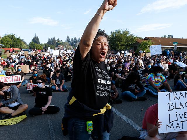 A protester shouts the name &quot;George Floyd!&quot; during a demonstration in Sacramento, Calif.  (AP Photo/Rich Pedroncelli)