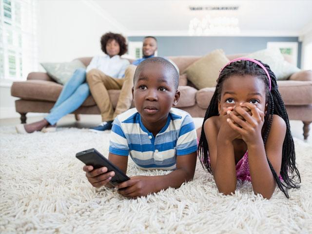 Shocked kids watching TV news